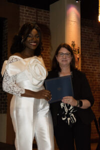 Dr. Paula Podrazik awards graduate Dr. Rachael Agbator with the Resident of the Year Award