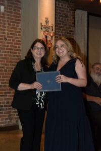 Dr. Paula Podrazik awards Dr. Lauren Ewing with the Faculty Teaching Award