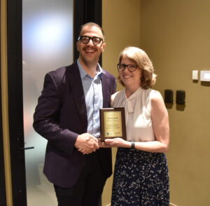 Resident physician, Dr. Alexander Malati, receives the UAMS Diamond Award from Dr. Veronica Raney.