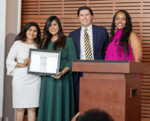 Family Medicine physician, Dr. Cheerla, receives a core faculty award from graduating chief residents, Dr. Mohsin, Dr. Newhart, and Dr. Udeogu.