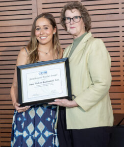 Graduating resident physician, Dr. Joyce Kuykendall, receives the Resident Teacher Award from Program Director, Dr. Julea Garner.