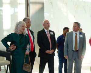 Dr. Kellar and wife, Donna, listen to Cody Walker's speech.