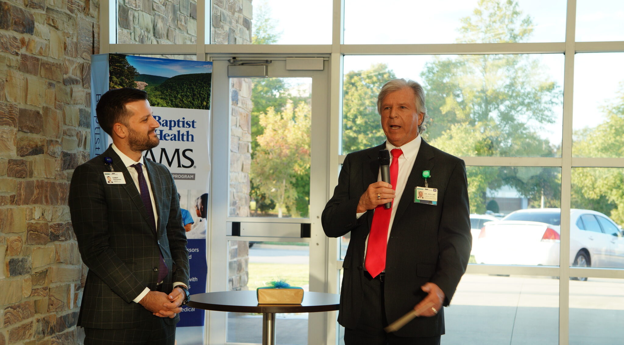 Dr. Kellar gives a speech next to Cody Walker at his send off party.